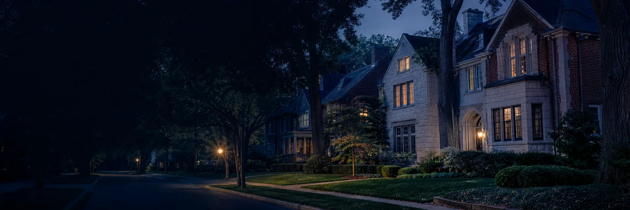 Illustrative Midwest college-town neighborhood at blue hour